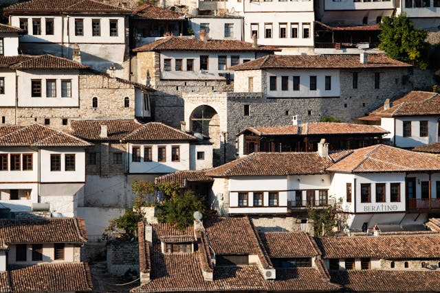 Scenic view of Berat, Albania, showcasing its historic Ottoman-era houses, stone buildings, and the iconic hillside architecture known as the 'City of a Thousand Windows